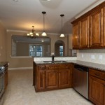 Kitchen with stainless steel appliances by Dennis Olive Homes